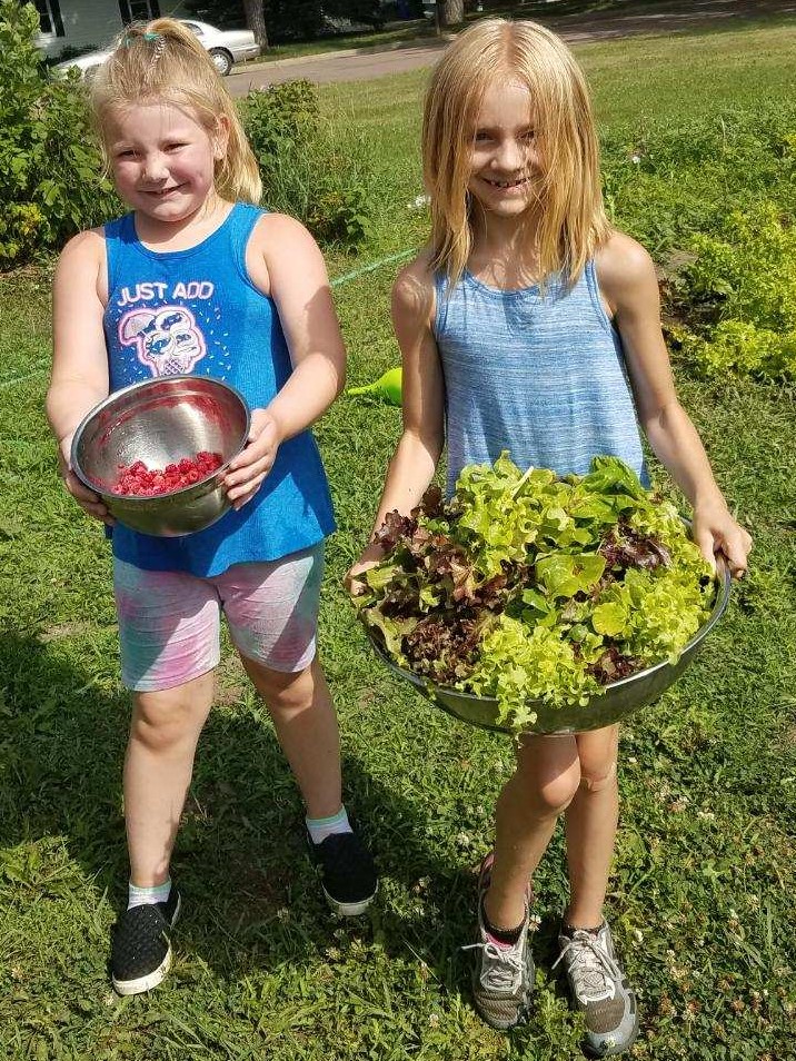 Girls Carrying Garden Produce