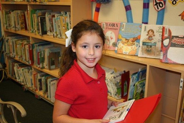 Girl holding library books