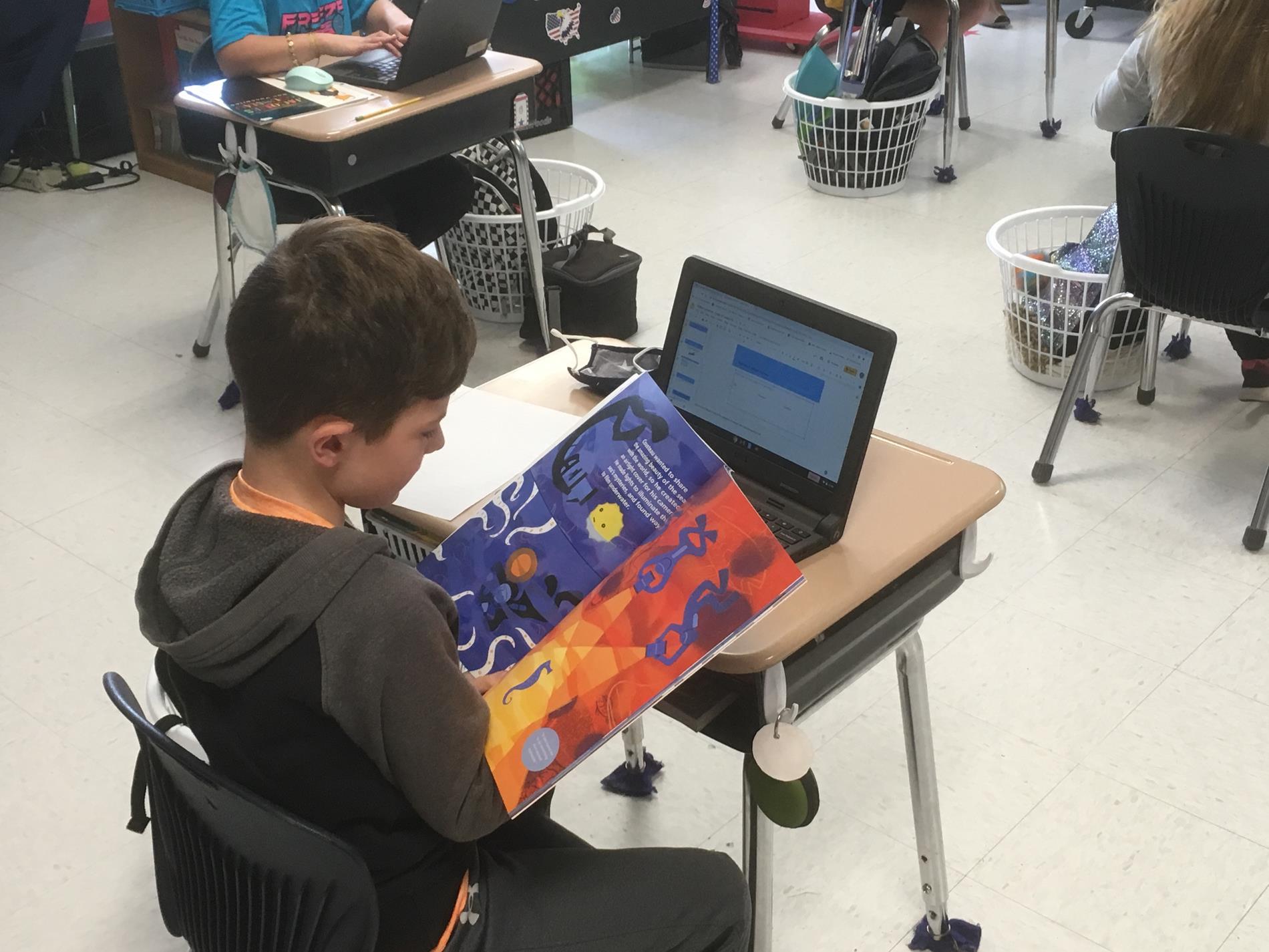 Student reading in classroom