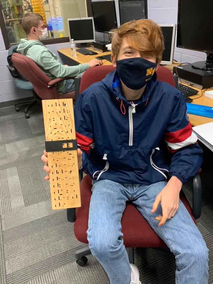 This student designed a mystery calendar by programming it in the computer and then having the CNC router cut it. He designed the slide sleeve and then had the 3-D printer print it to complete his project.