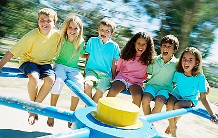 children on a merry go round