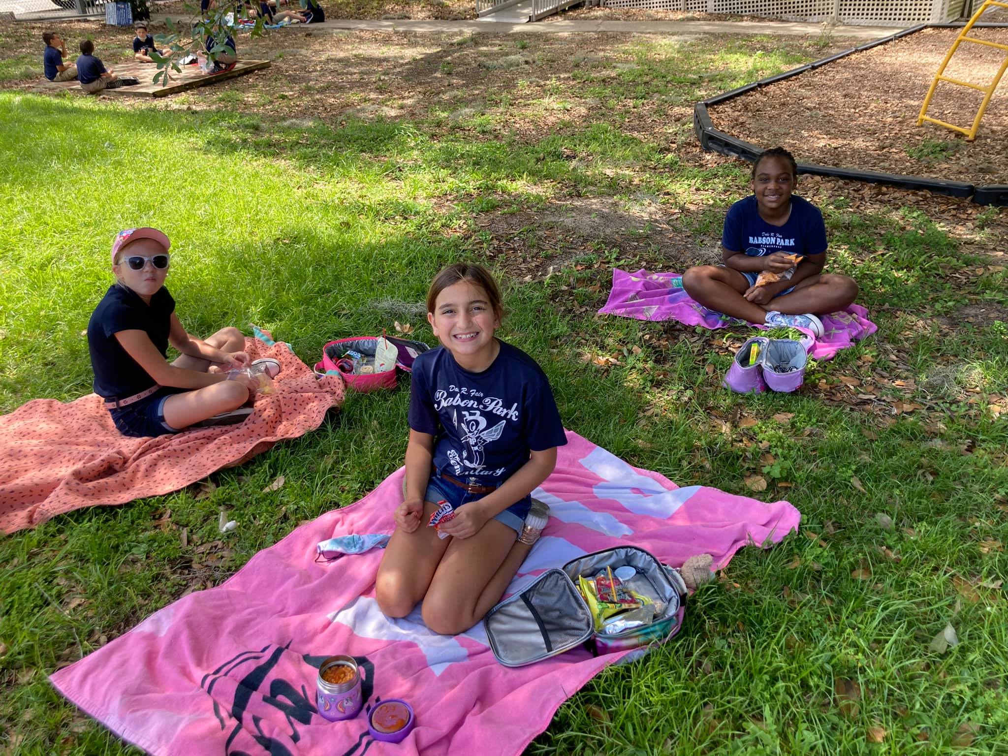 Students enjoying their picnic lunch.