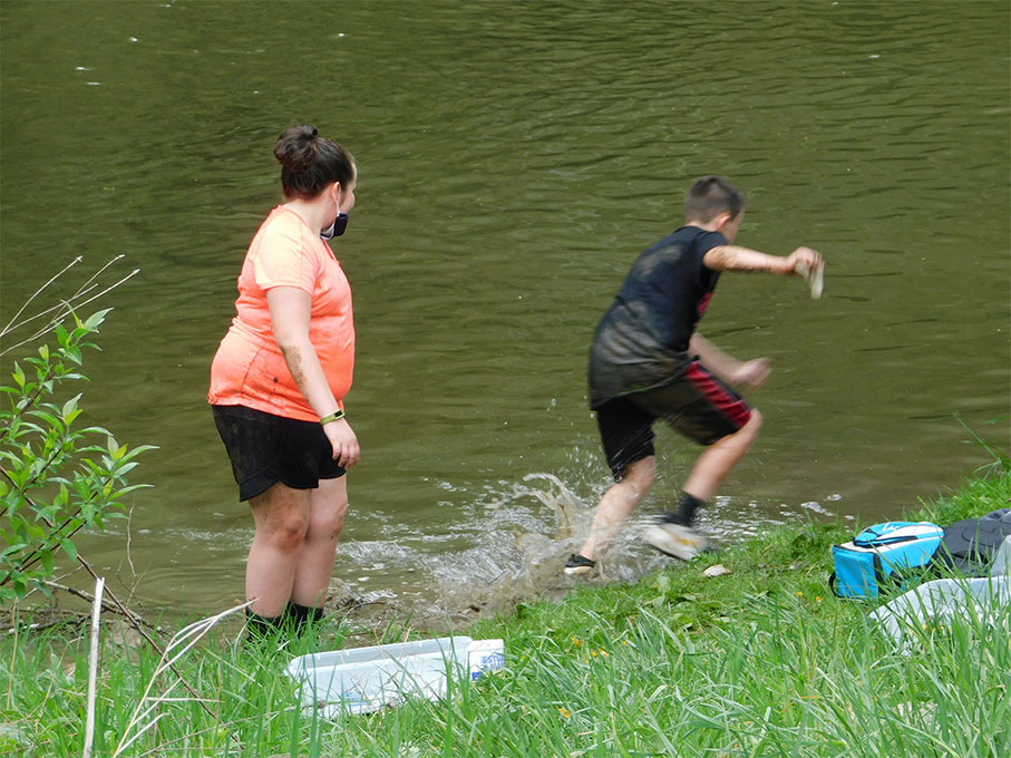 testing the creek's water quality