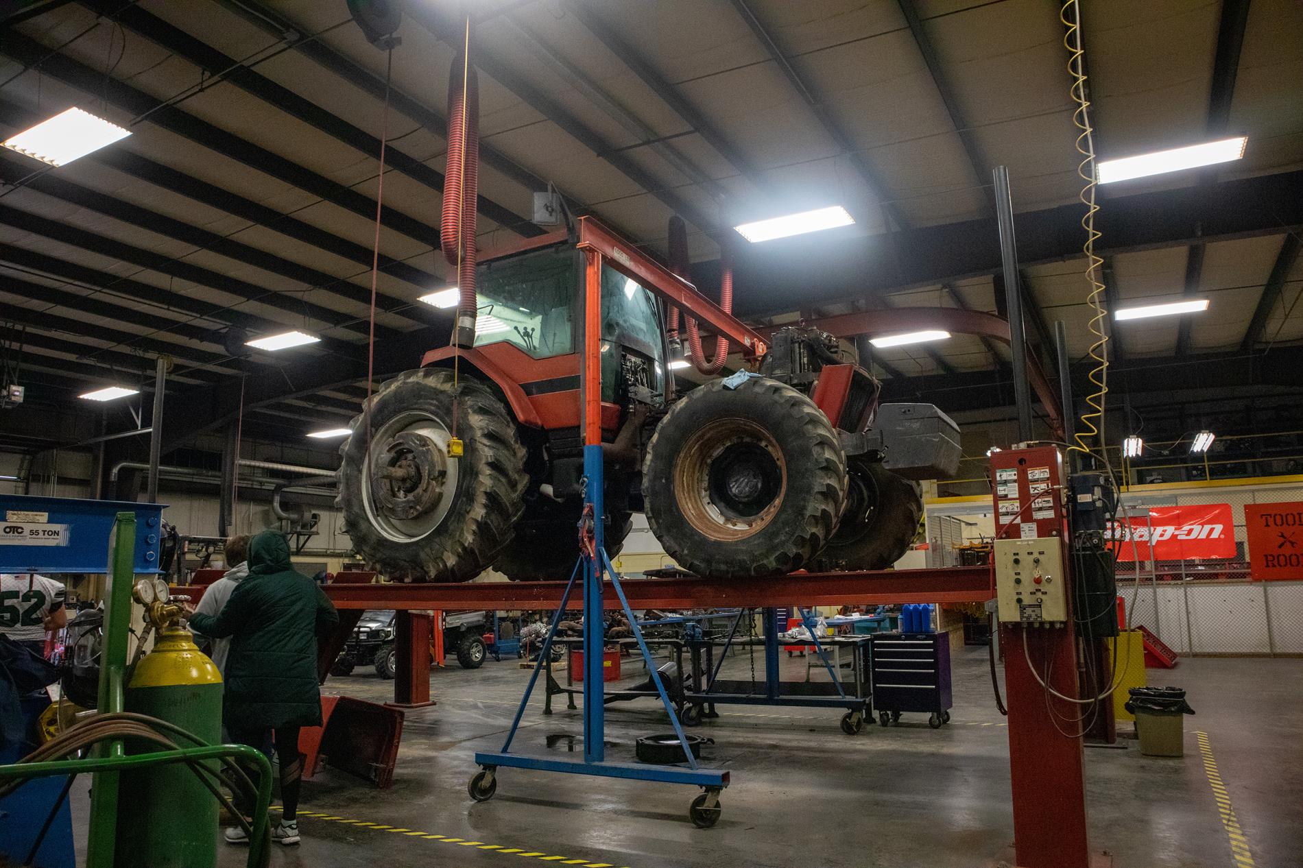 Students working on a tractor.