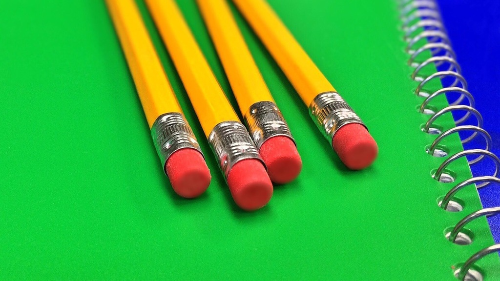 Pencils on Green Notebook