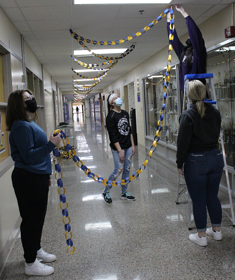 Students decorate the halls preparing to return to school