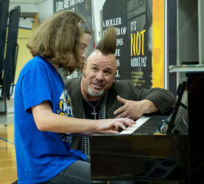 Christopher Milo's assembly student playing piano