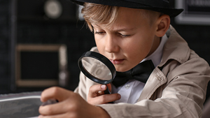 image a boy with magnifying glass