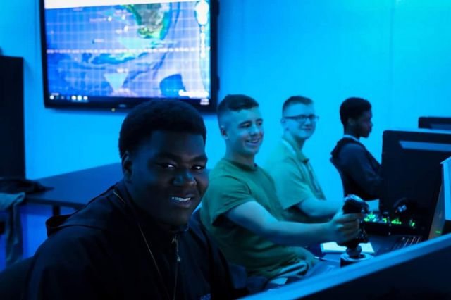 Students attended the National Flight Academy in Pensacola, Florida for 6 exciting days. Students were in a building that has been set up like an aircraft carrier. While aboard the aircraft carrier Ambition, students worked together to complete missions using the flight simulators, Joint Operations Center, and using the world's largest tablet.