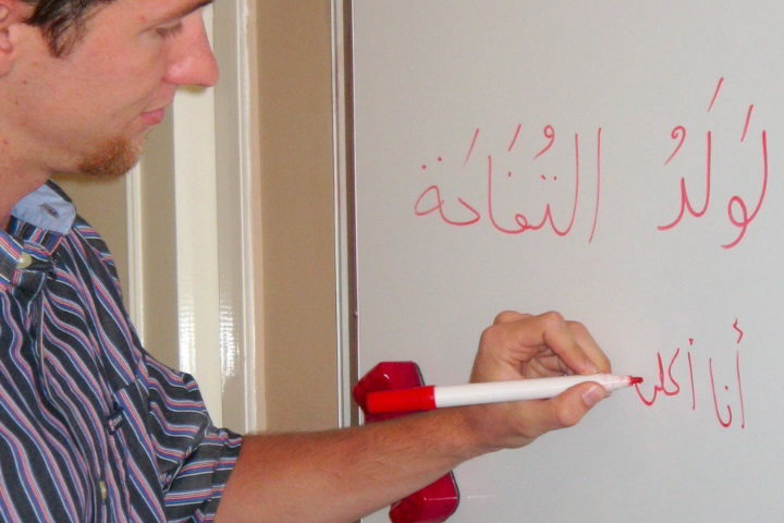 Person writing on board