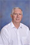 Man with gray hair and white shirt Man with gray hair and white shirt