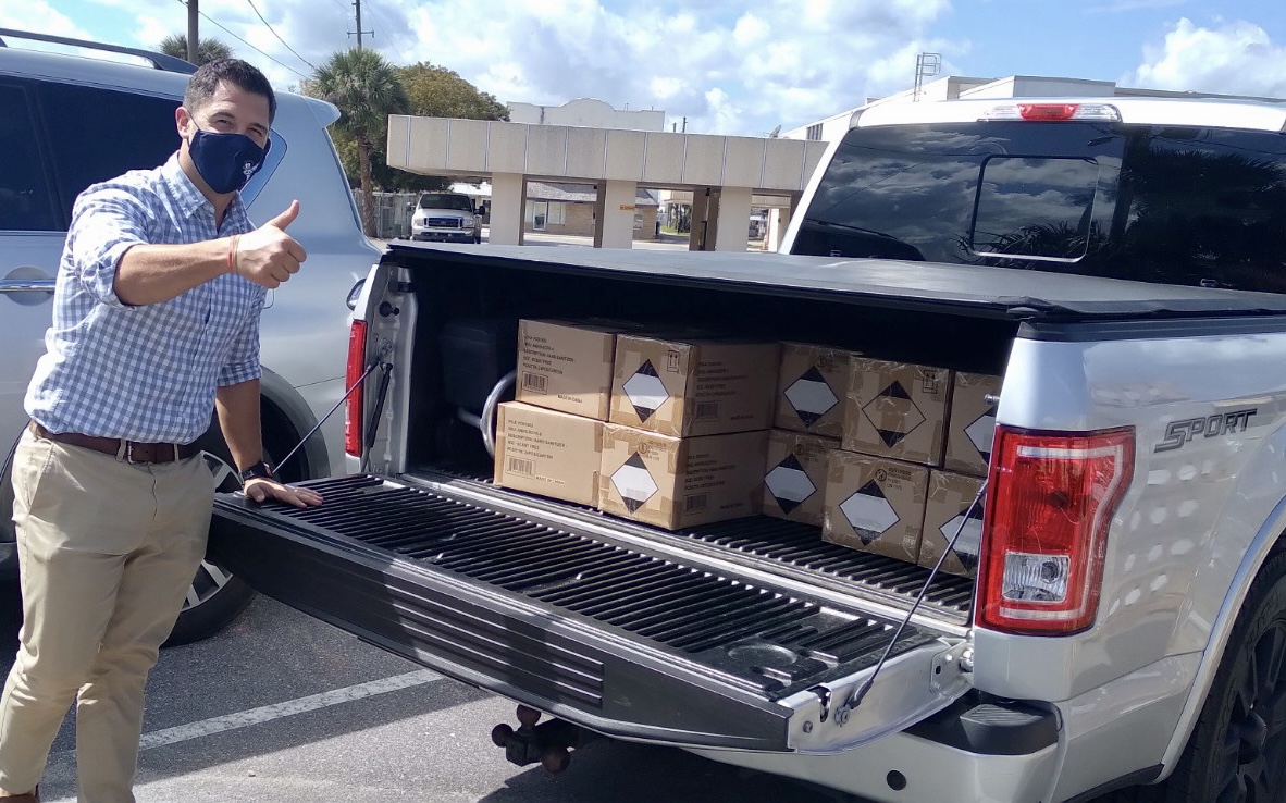 Mr. Fann with the donation to Dale R. Fair Babson Park Elementary.