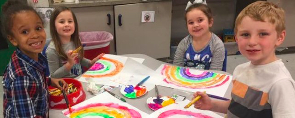 Kids painting rainbows