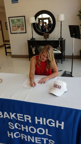 Lexa Marchese signing her letter of intent to play golf at Huntingdon College.
