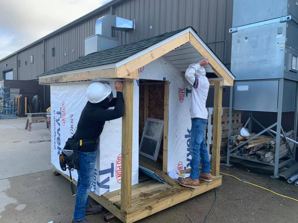 Building the playhouse for the annual raffle held each November 