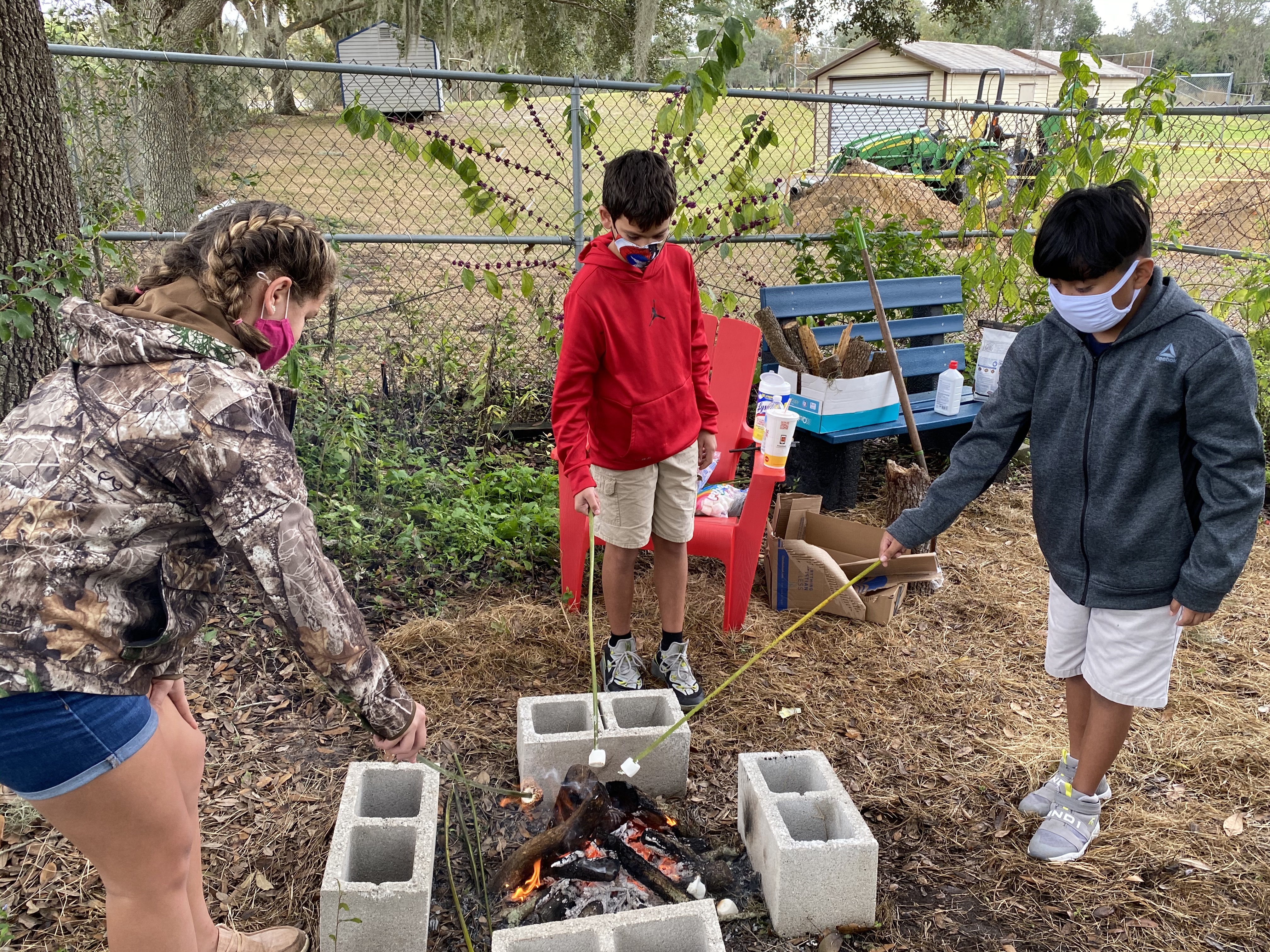 Students roasting marshmallows