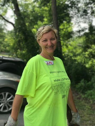Female Principal in a "Make a difference" Day shirt 