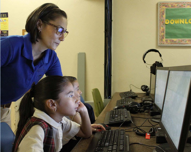 Teacher and student at the computer