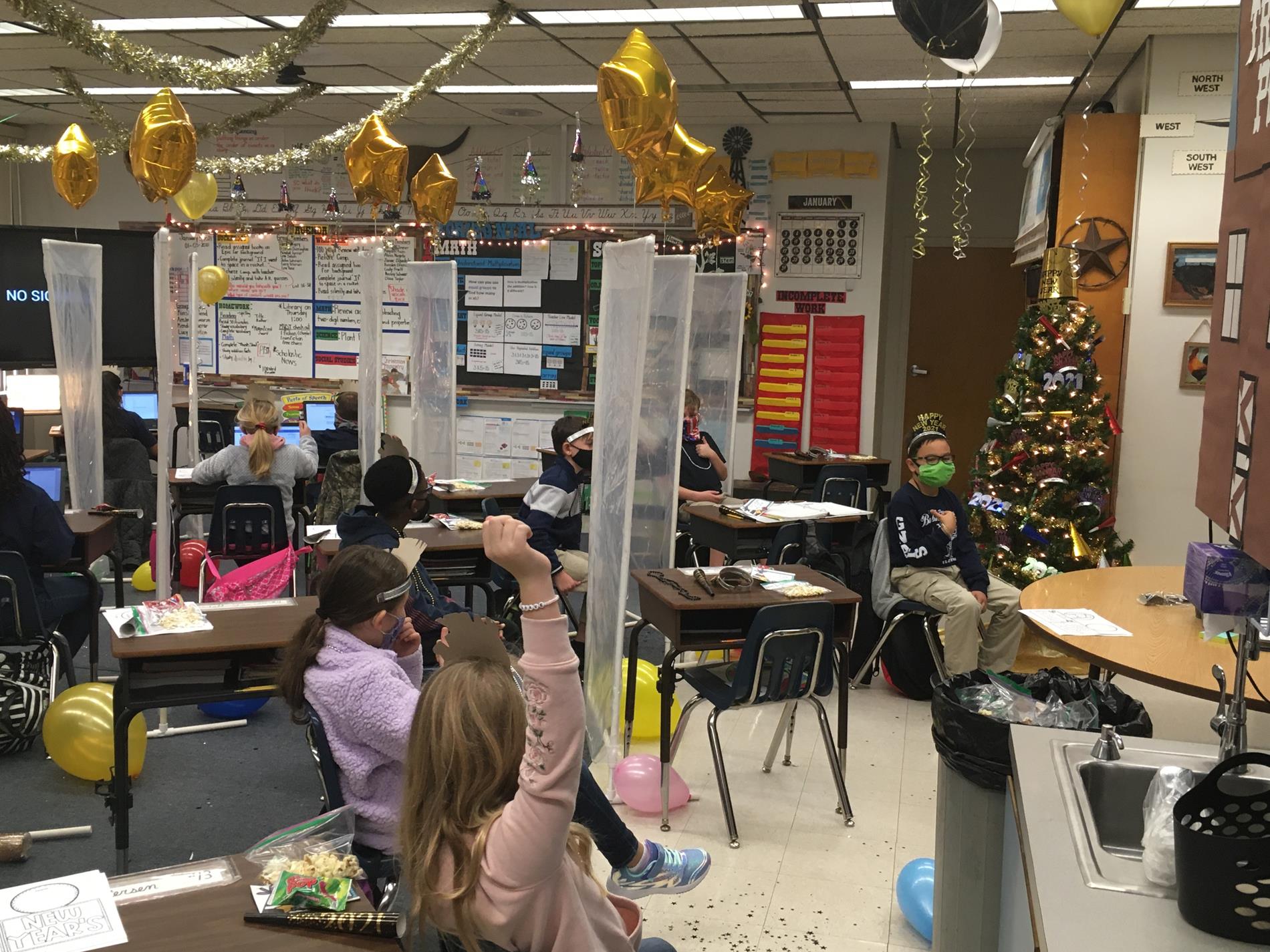 Classroom decorations with balloons and streamers hanging