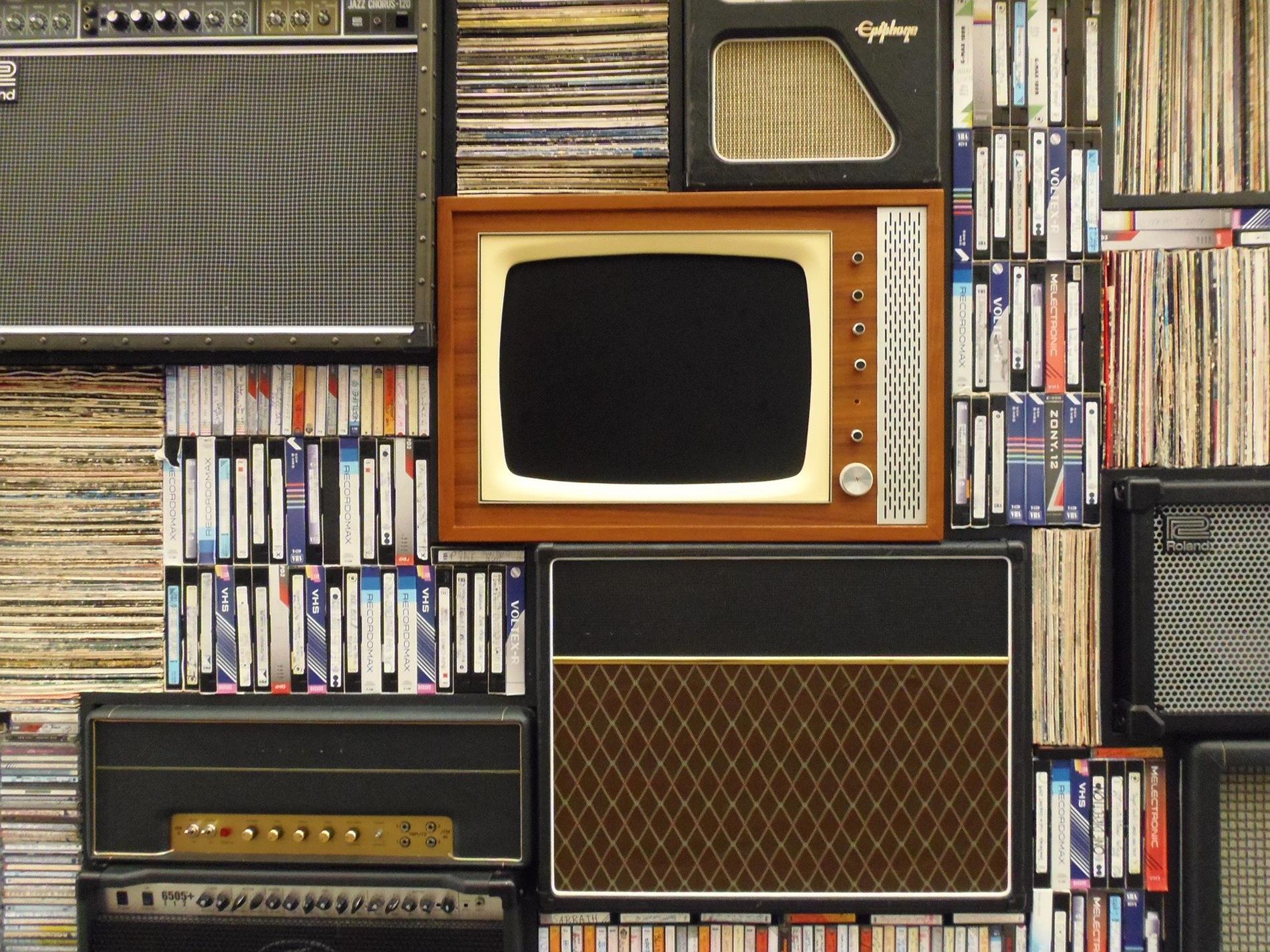 retro television on shelf with books