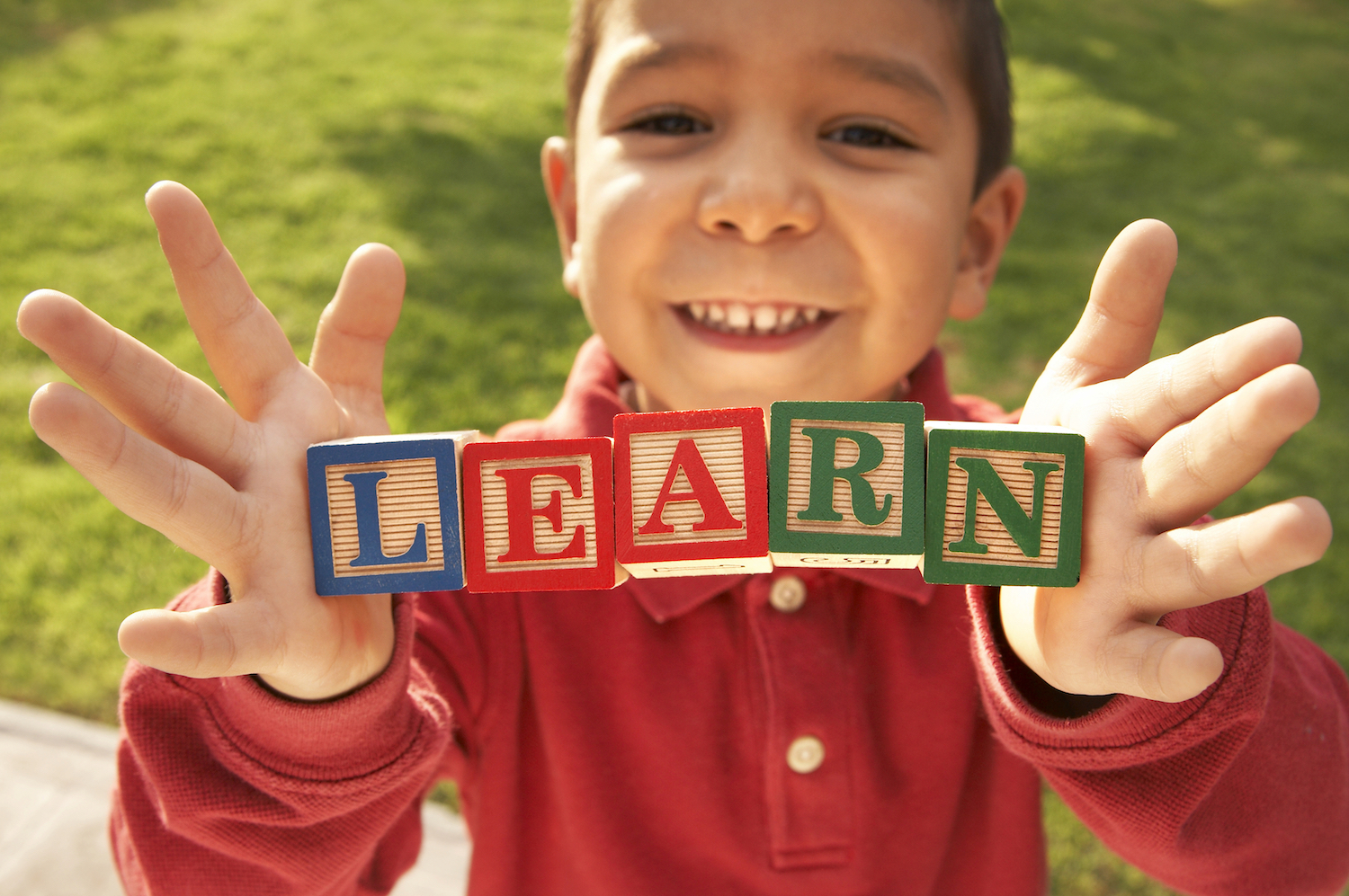 boy with building block letters