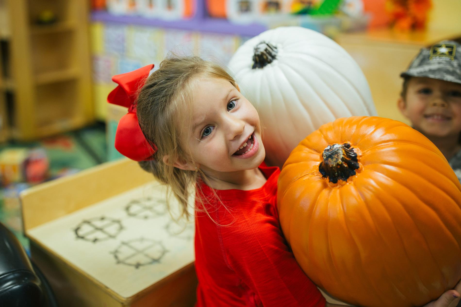 Child with pumpkins