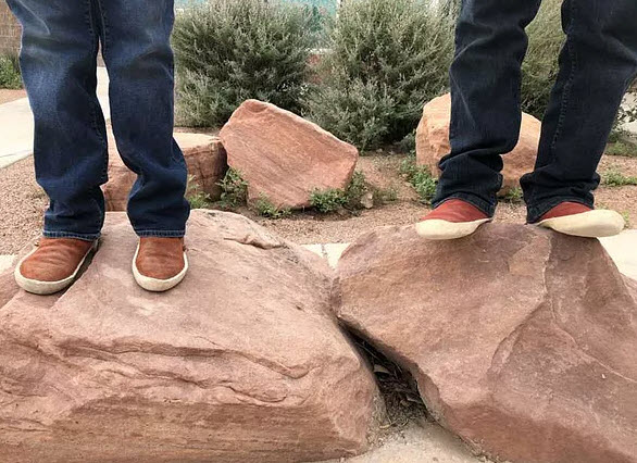 kids feet on rocks
