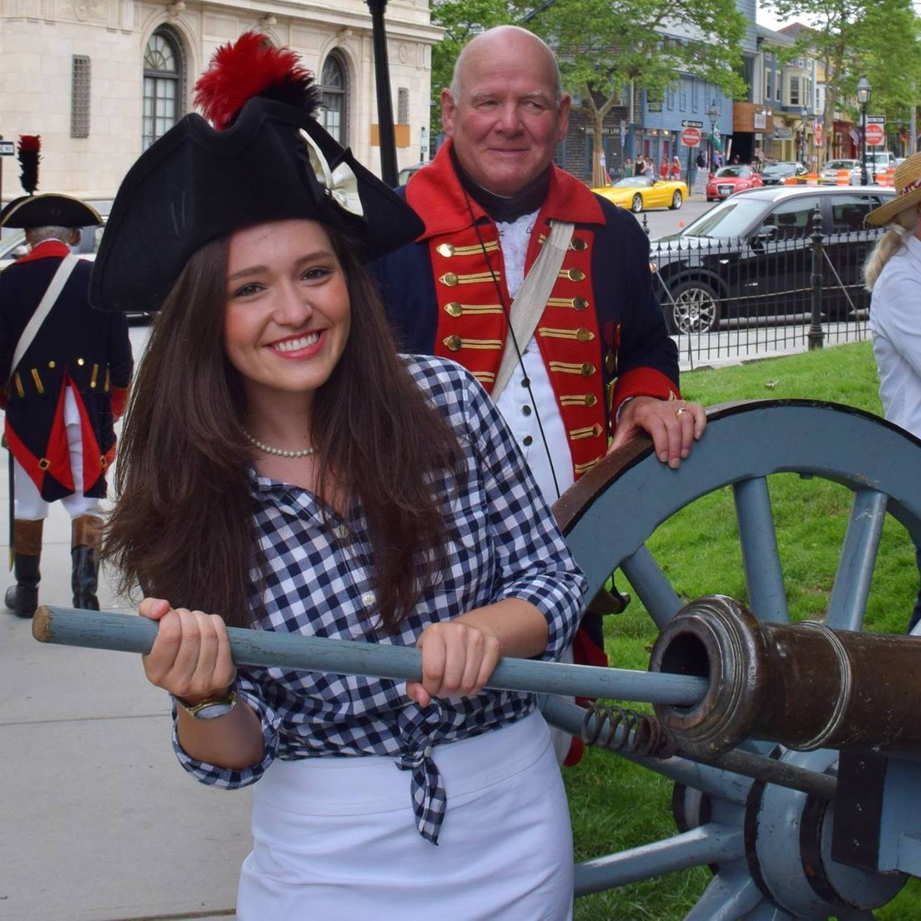 Mrs. Costley with a cannon made by Paul Revere