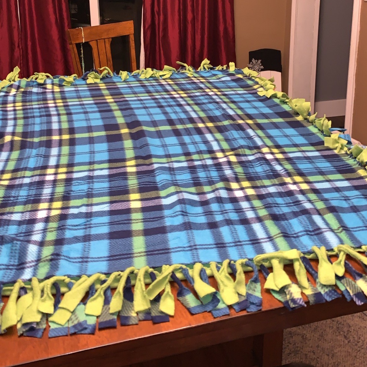 Students making blankets for Aledo nursing home residents