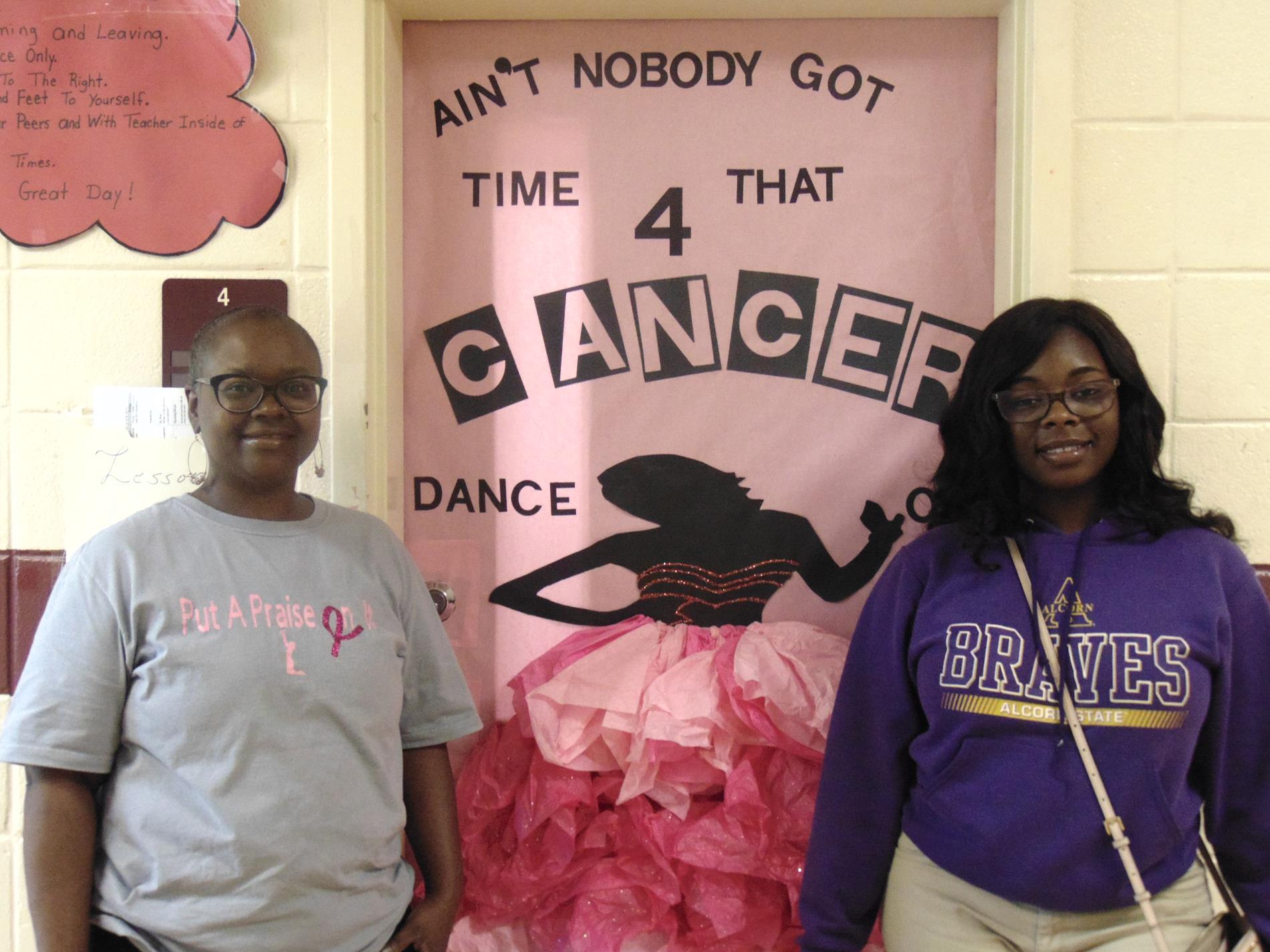 Eboni Winder and mother with Breast Cancer Awareness door design