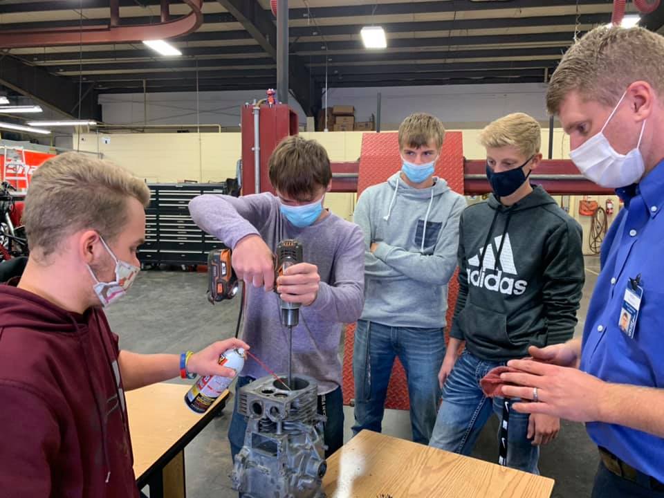 Students in Power Tech use collaboration and teamwork to rehone and cross-hatch a cylinder.