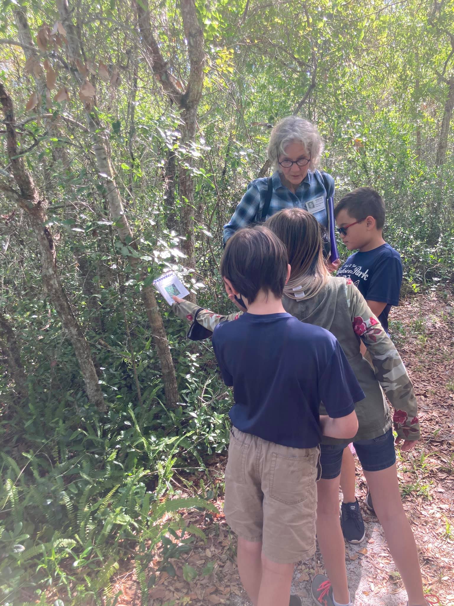 Students learning information from their trail guide.