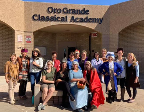 staff in front of school in costumes staff in front of school in costumes