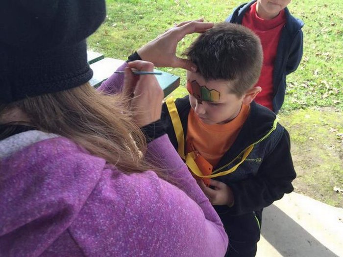 Getting his face painted