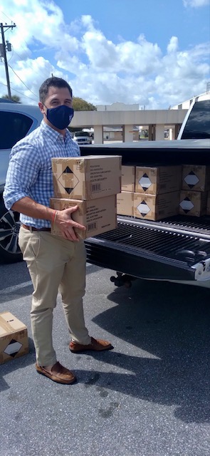 Mr. Fann loading boxed into his truck.
