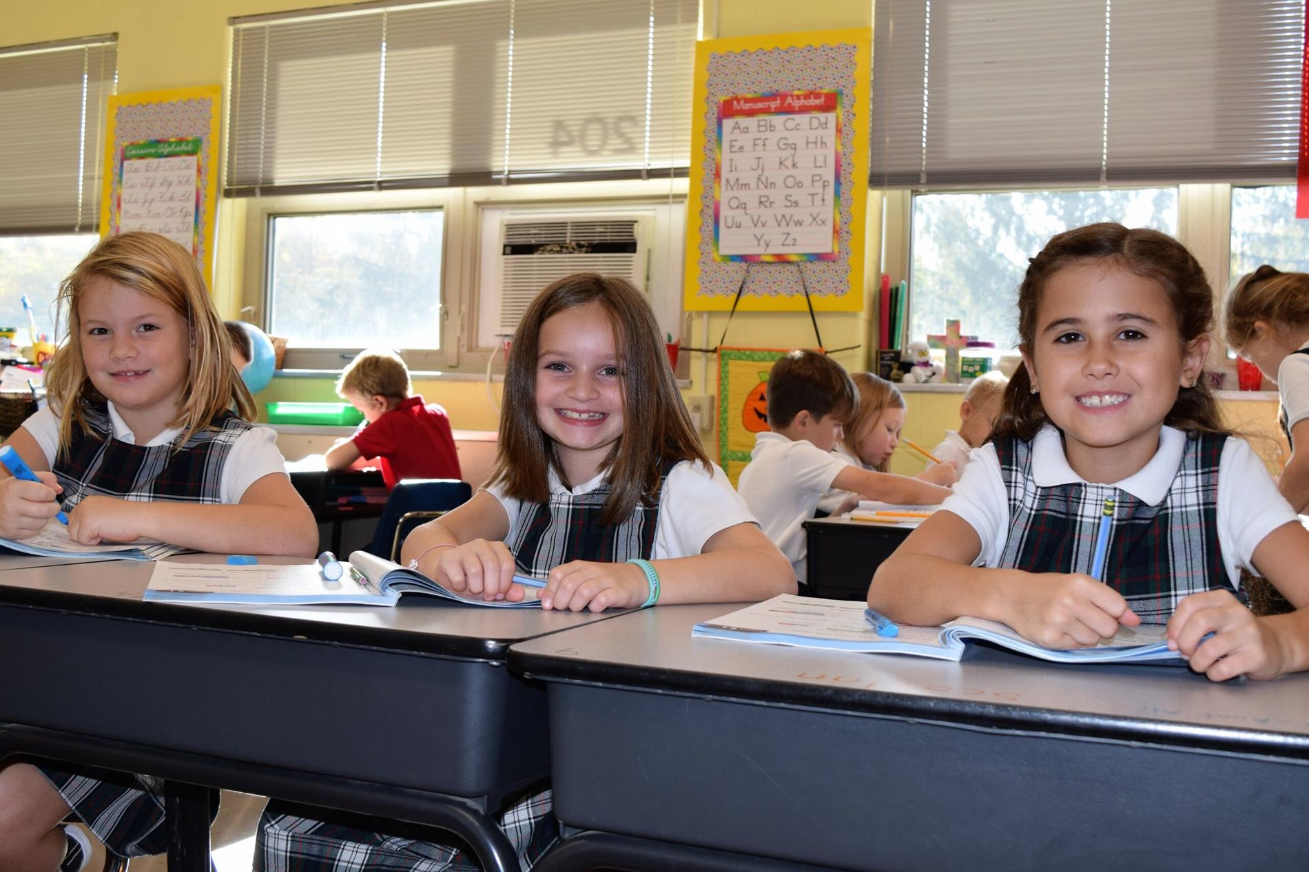 children at desk working children at desk working
