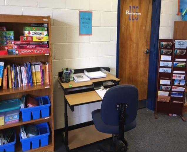 parenting center picture of desk, books, and games