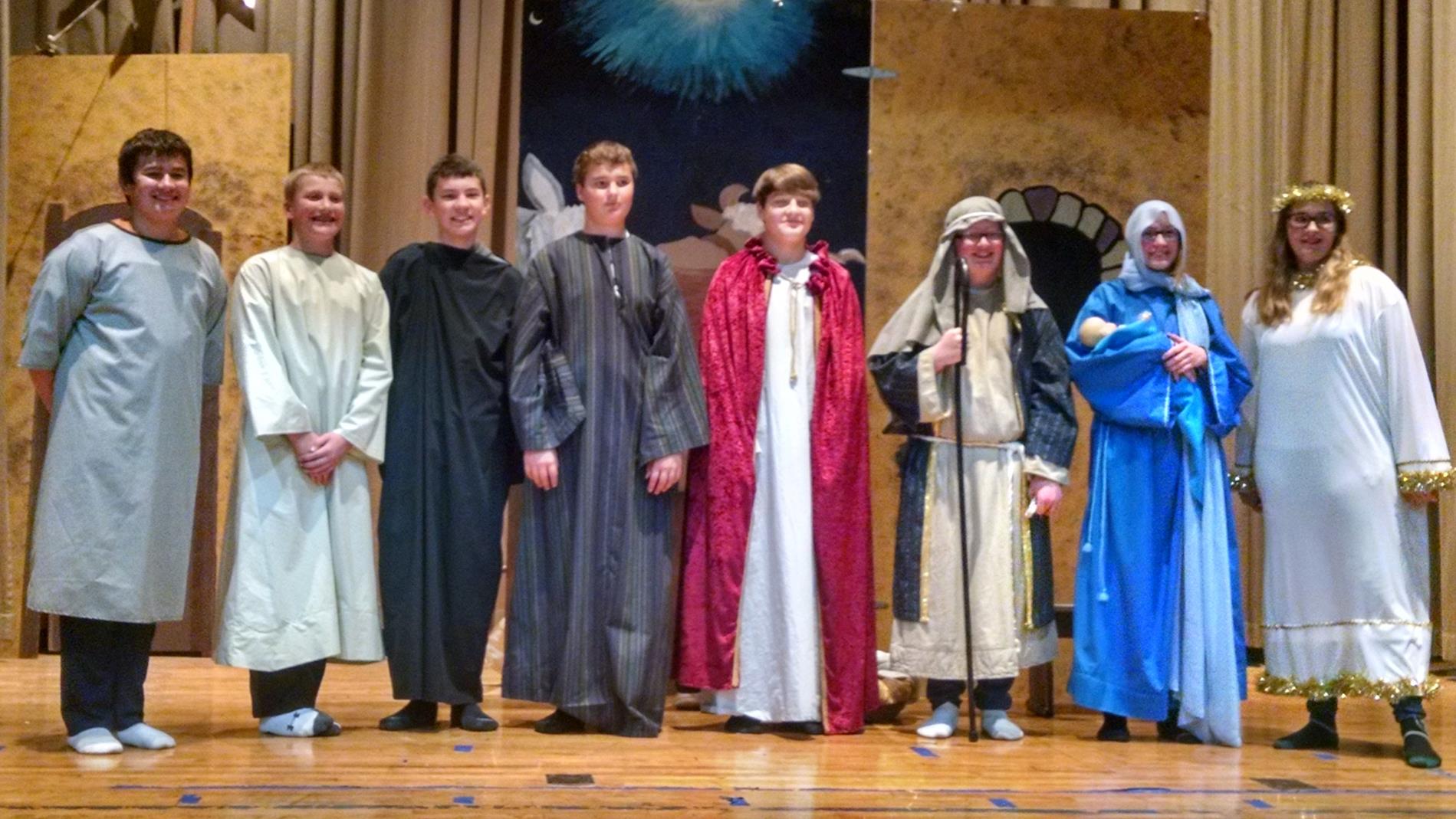 7th and 8th Grade Students Posing for Picture in Nativity Costumes