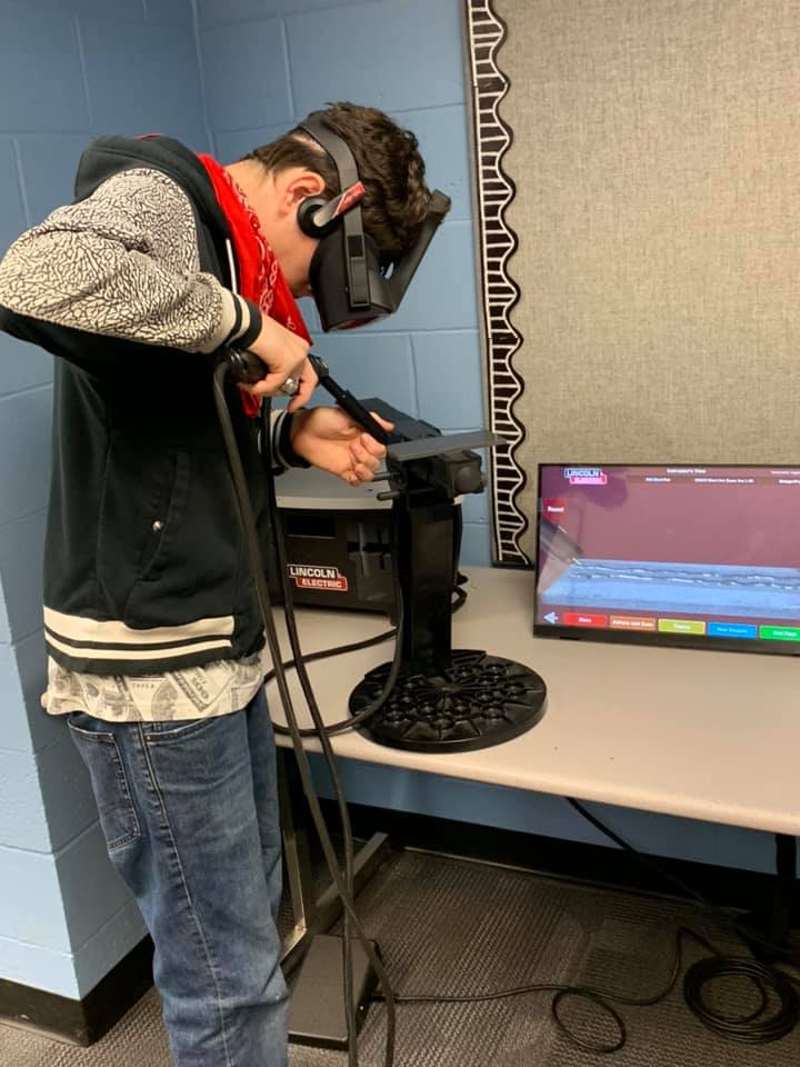 A student works on the welding simulator.