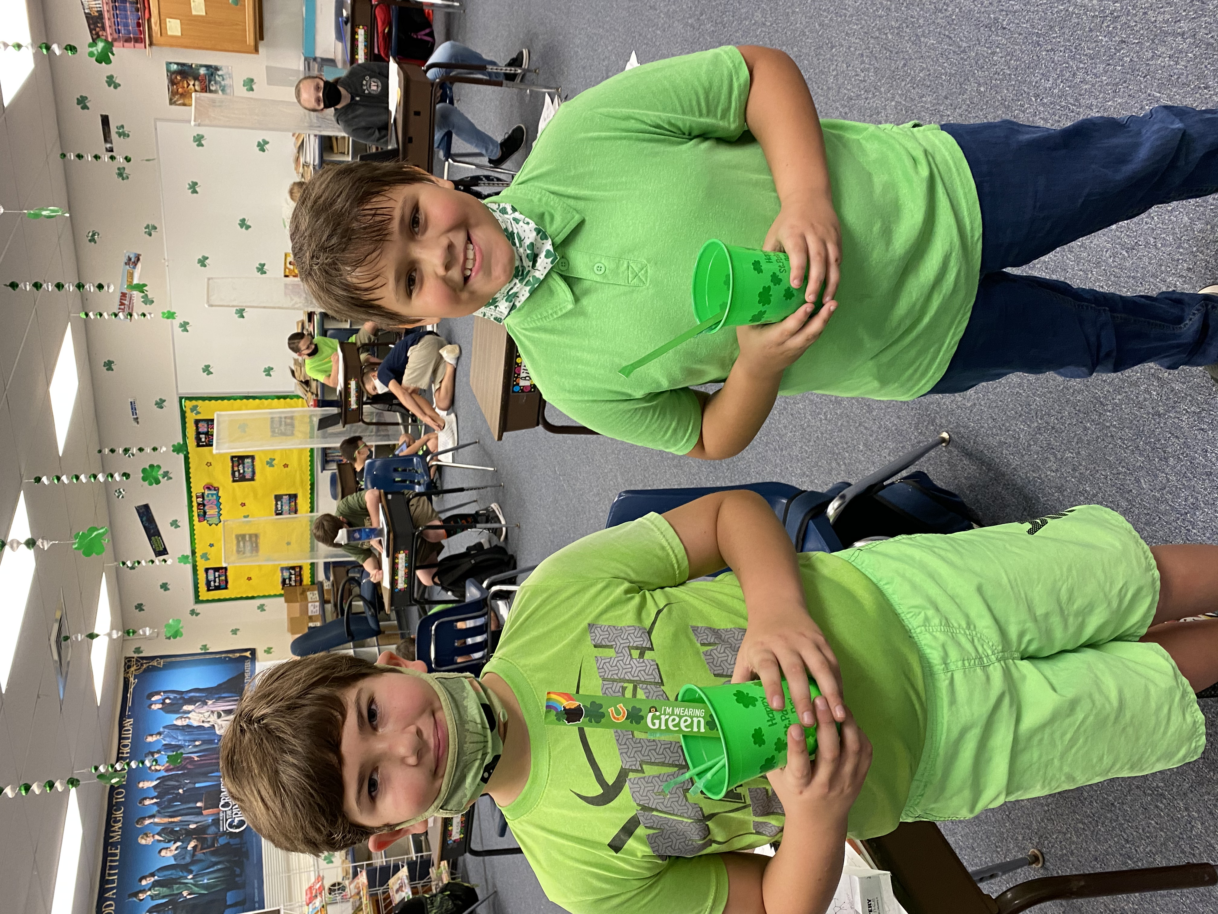 Two 5th grade students showing off their prizes for completing the Escape Rooms.