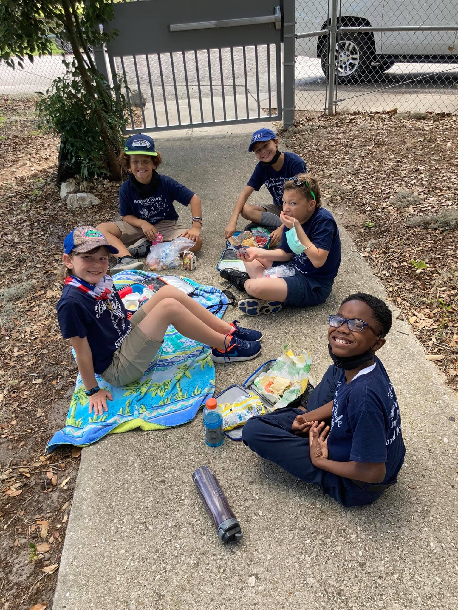 Students enjoying their picnic lunch.