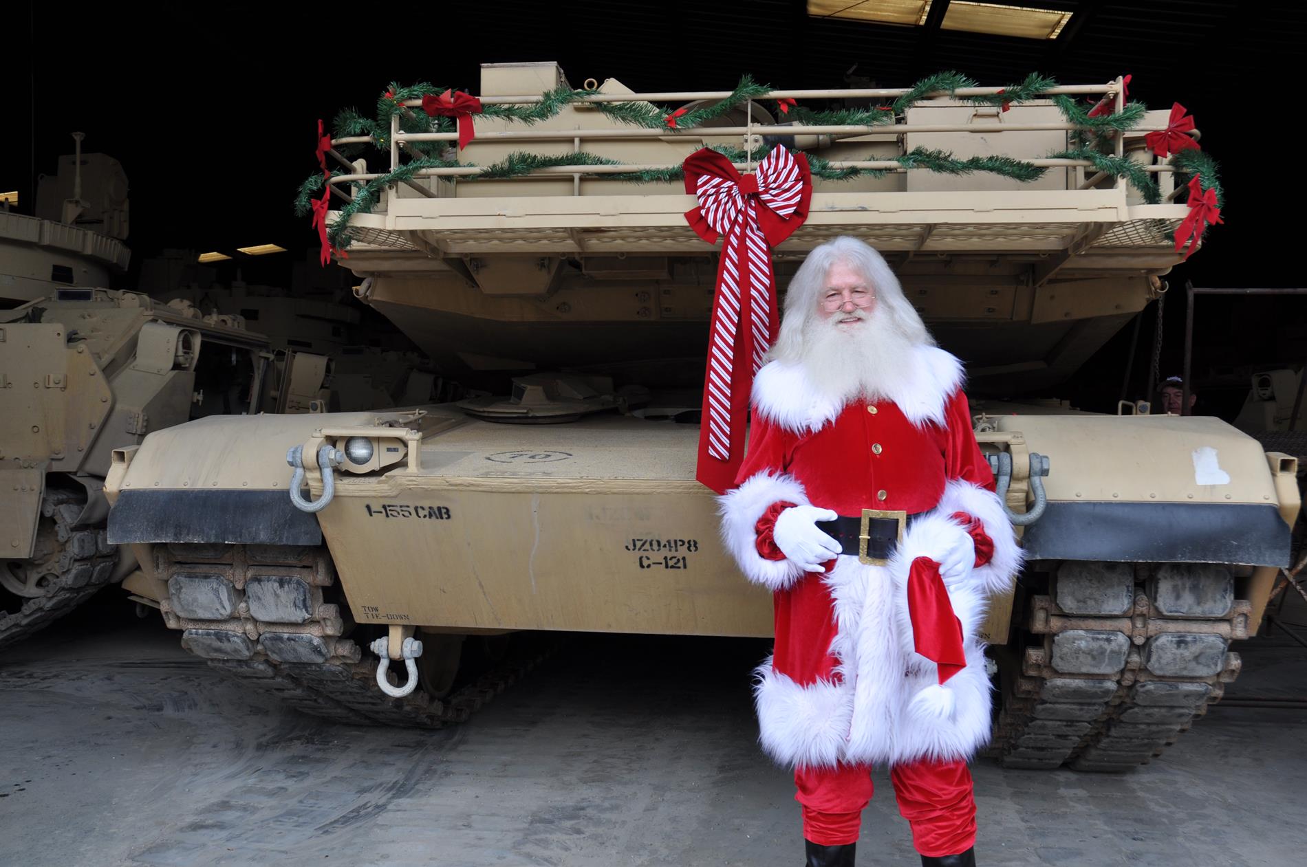 Santa loves his military ride