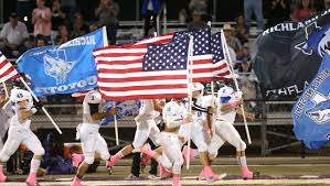 Team running with USA Flag and Richland Springs Flag