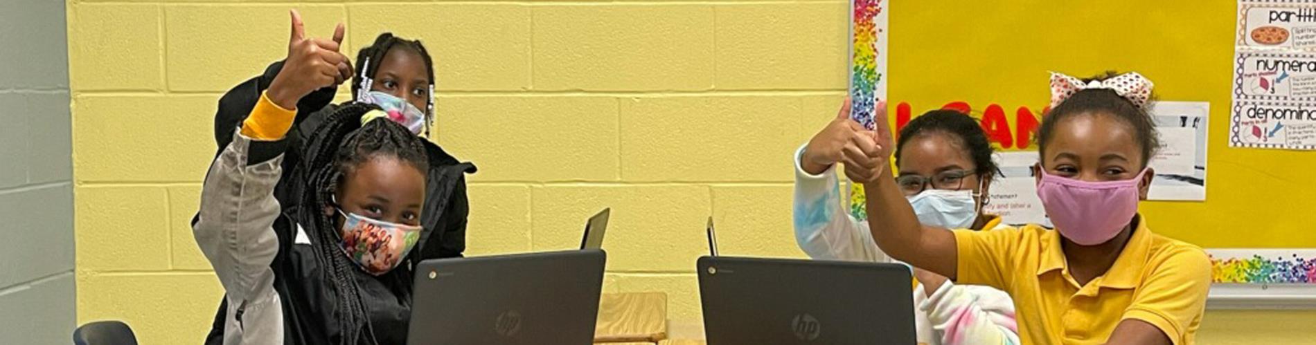 Students with their Chromebooks