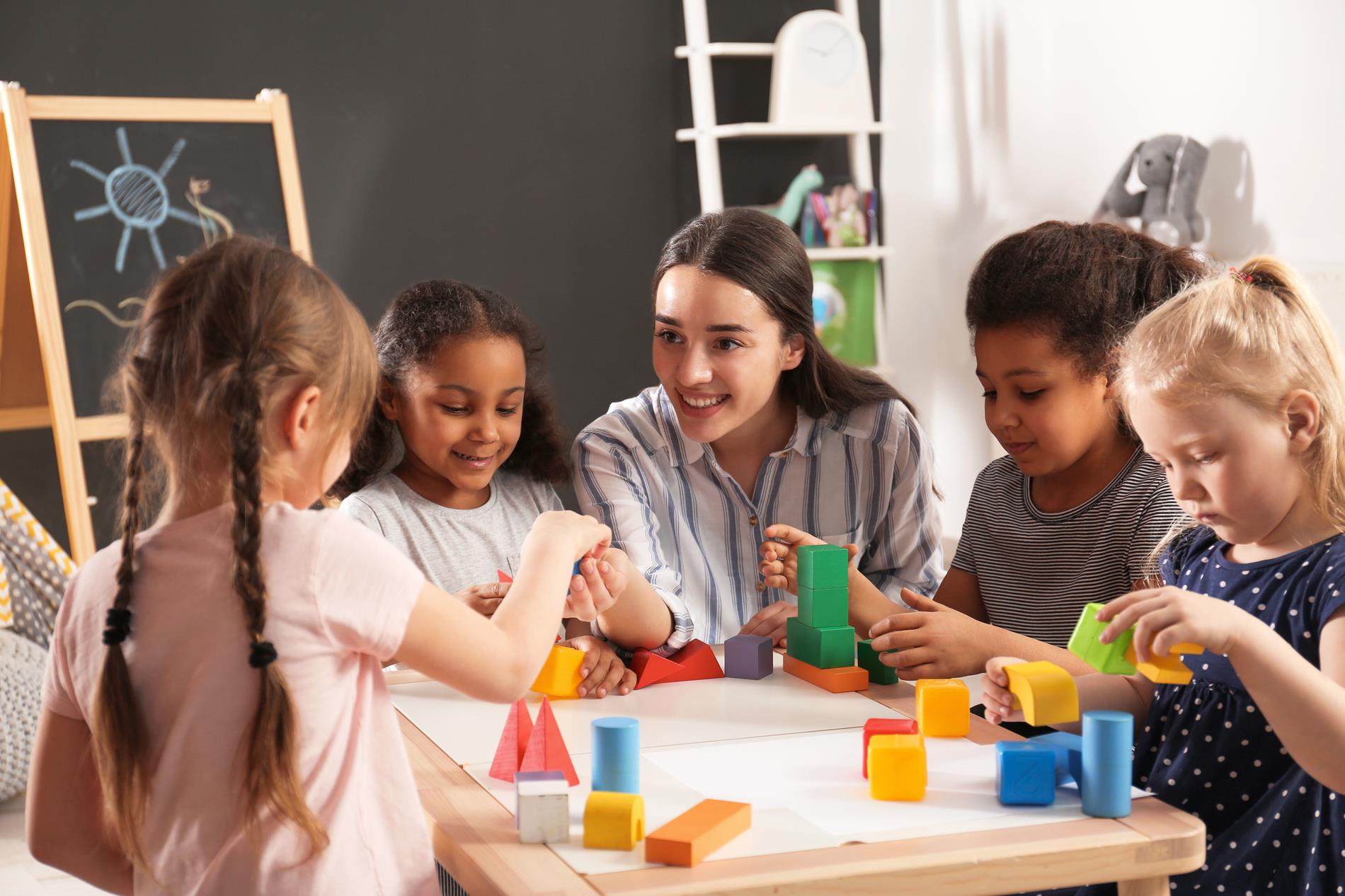 kids with their teacher in classroom