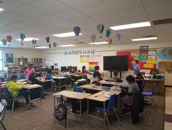 4th graders at desks 4th graders at desks