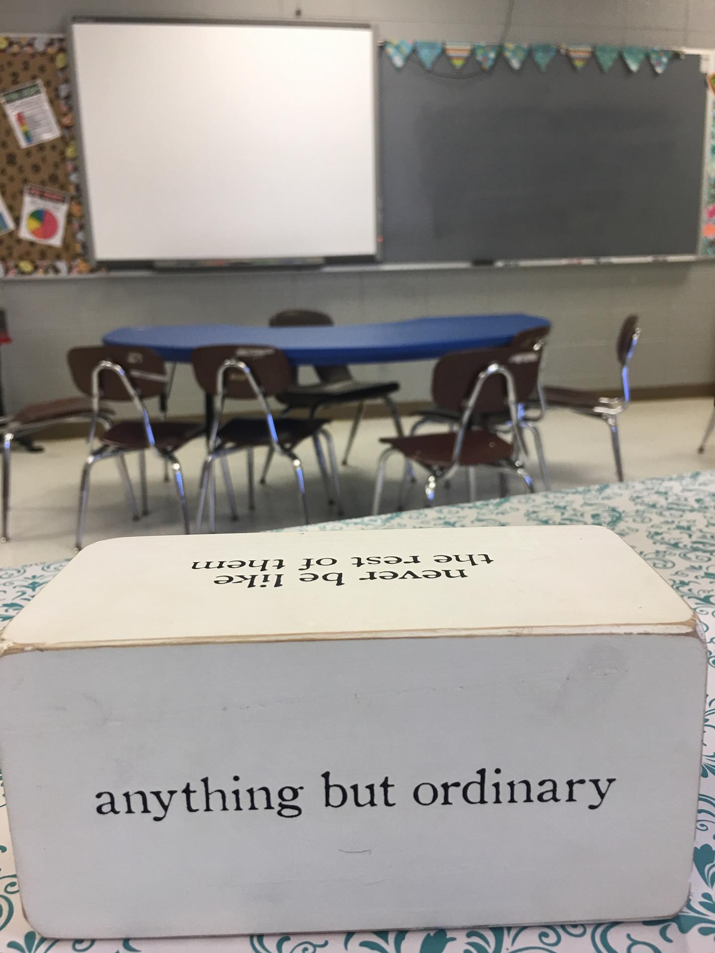 Picture of Mrs. Vick's room with the saying "Anything but ordinary" showing.