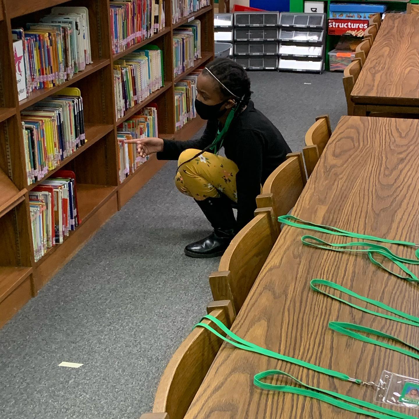 Student searching the stacks