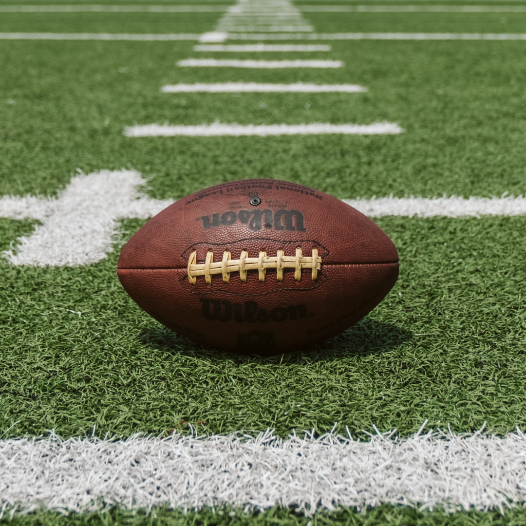 Football laying on turf Football laying on turf
