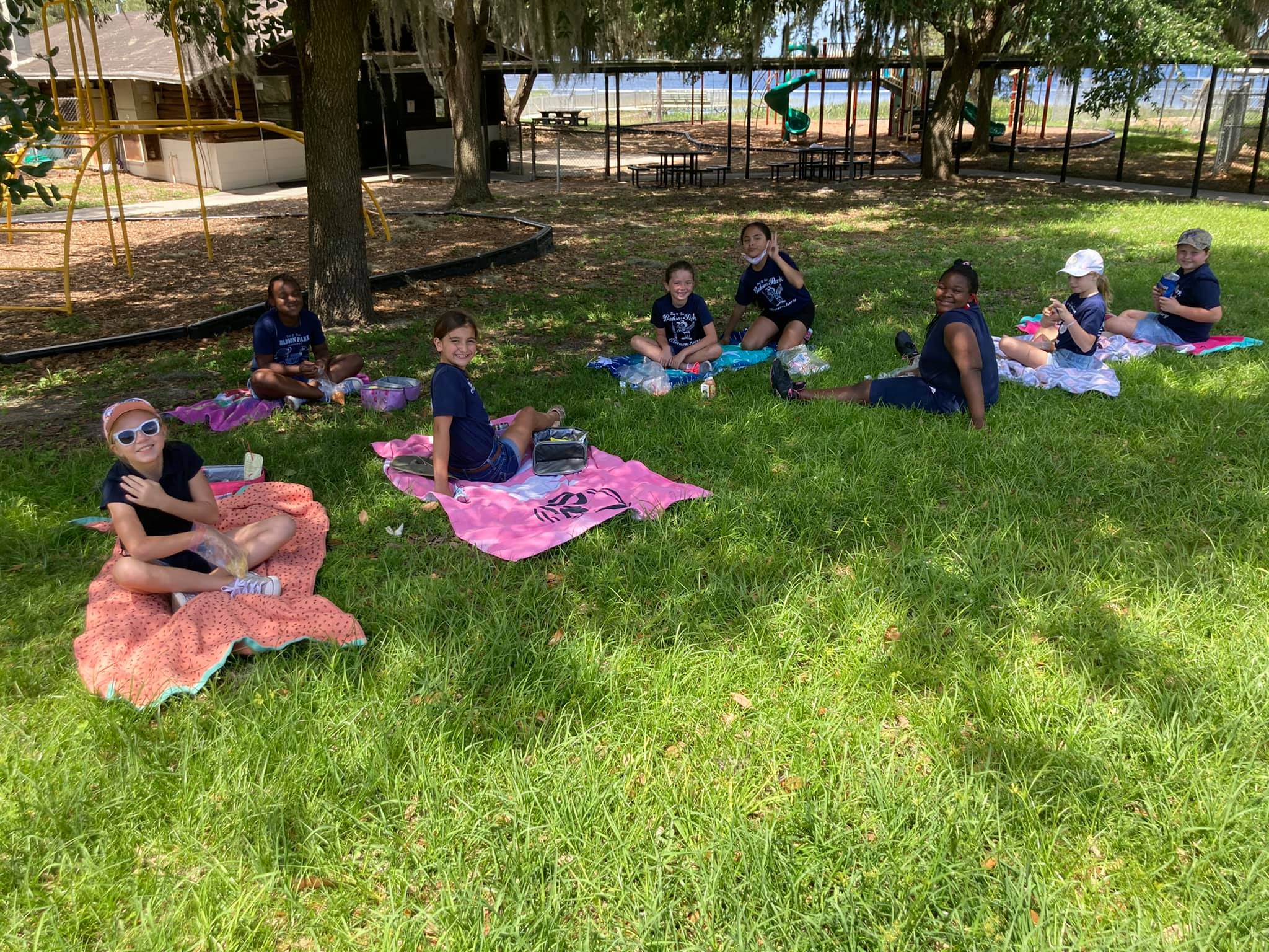 Students enjoying their picnic lunch.